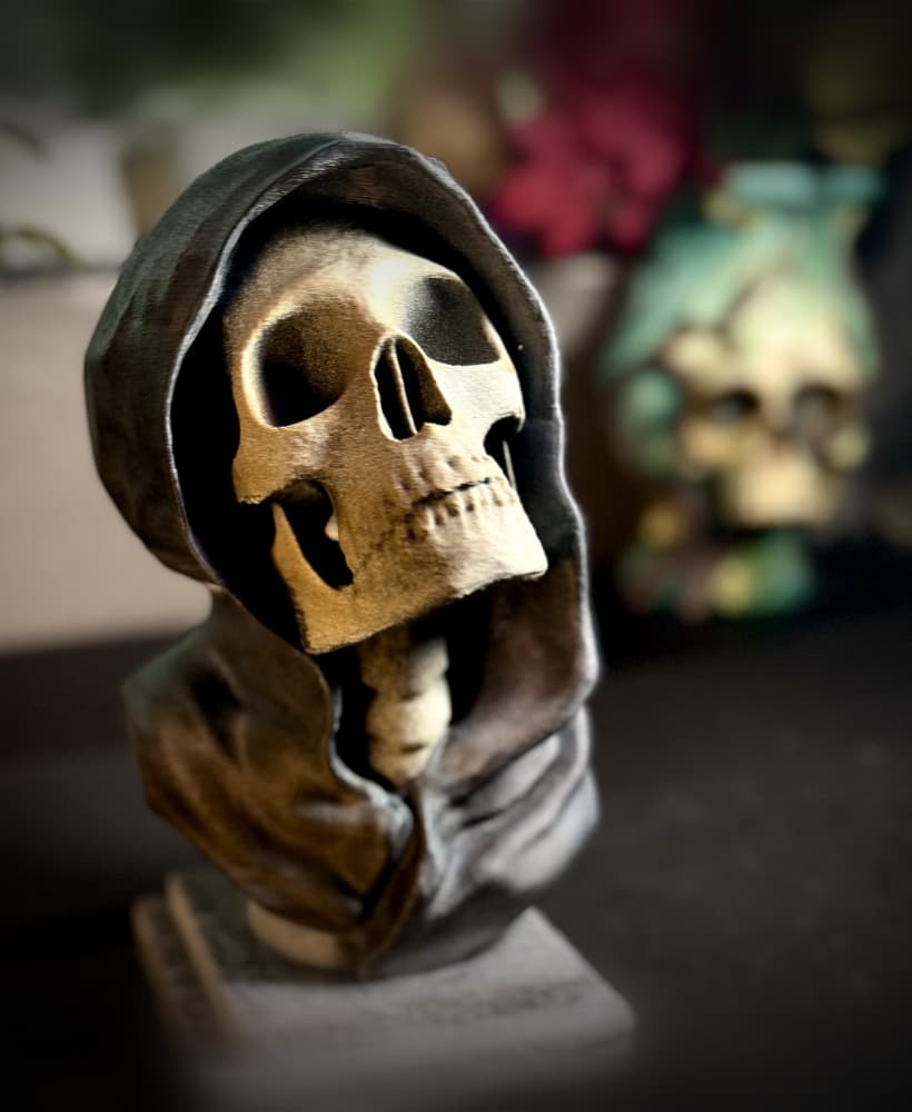 Hooded skull statue and bookends