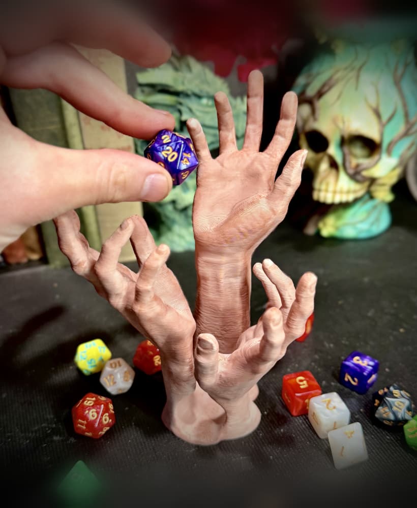 three hands dice tower